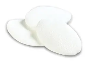 Three white cloth pads on a white surface.