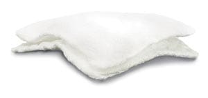 A white fluffy pillow on a white surface.