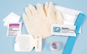 A medical kit with gloves, bandages and tape.