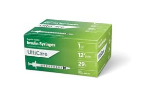 A box of unc care syringes on a white background.