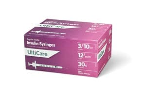 A box of pink syringes on a white background.