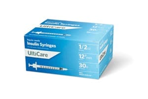 A box of uk care syringes on a white background.