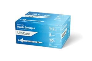 A box of unc care syringes on a white background.