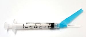 A syringe with a blue syringe.