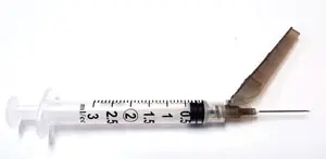 A syringe with a needle attached to it.