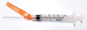 A syringe with an orange ribbon attached to it.