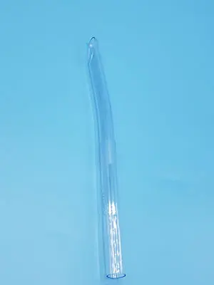 A clear plastic tube on a blue surface.