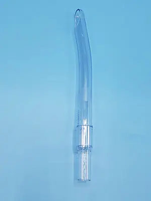 A clear plastic syringe on a blue background.