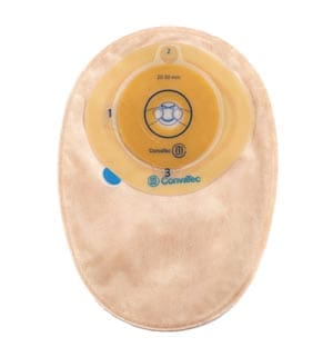 A beige pad with a blue button on it.