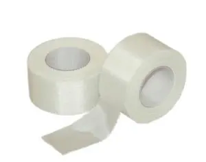 Two pieces of white tape on a white background.