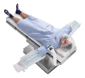 An image of a person laying on a surgical table.