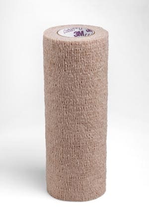 A roll of beige bandage on a white background.