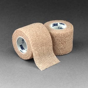 Two rolls of medical tape on a grey background.