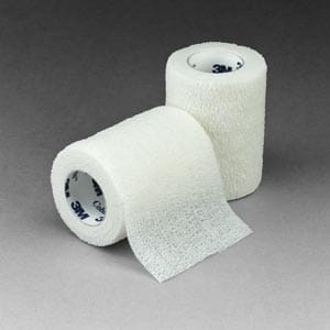 Two rolls of white bandage tape on a grey background.