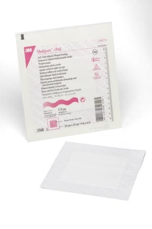 A white pad with a pink label on it.