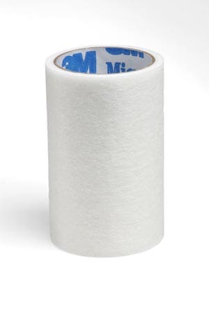 A roll of white tape on a white surface.