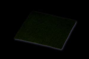 A square piece of green cloth on a black background.