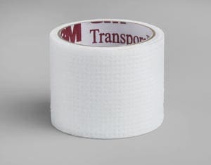 A roll of white tape on a grey background.