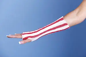 A woman wearing red and white striped wrist warmers.