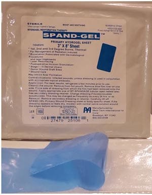 A package of spandex with a blue bandage on it.